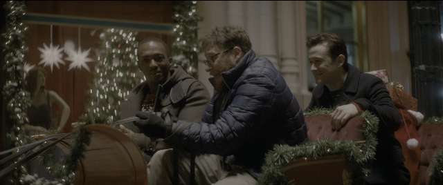 Wide shot frame from The Night Before — sitting, dialogue, person