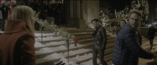 Wide shot frame from The Night Before — walking, dialogue, phone