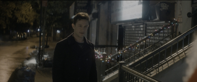 Wide shot frame from The Night Before — standing, street, night