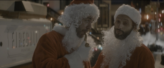 Wide shot frame from The Night Before — standing, street, hand