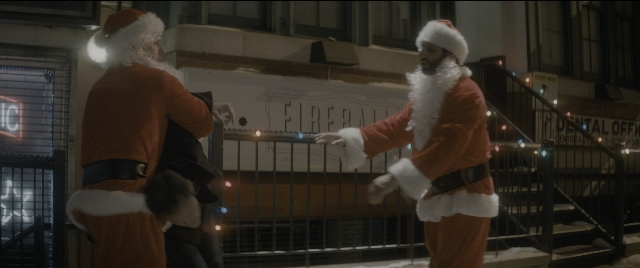 Wide shot frame from The Night Before — standing, street, suit