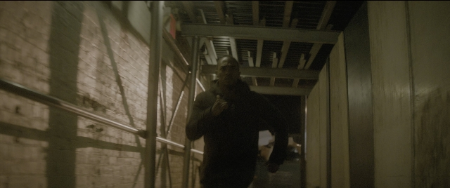 Wide shot frame from The Night Before — walking, hat, hand