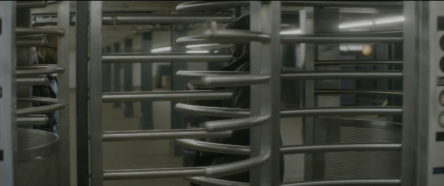 Wide shot frame from The Night Before — walking, person, door handle