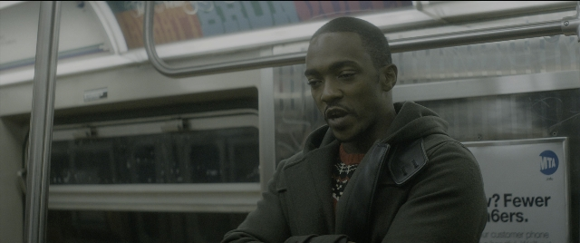 Wide shot frame from The Night Before — sitting, shirt, face