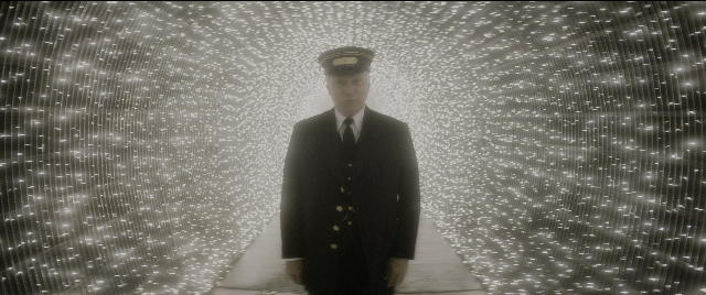 Wide shot frame from The Night Before — standing, hat, uniform
