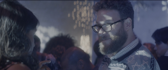 Medium shot frame from The Night Before — standing, room, dialogue