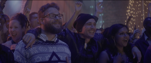 Wide shot frame from The Night Before — room, beard, person