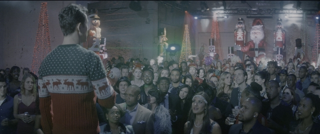 Wide shot frame from The Night Before — standing, room, hat