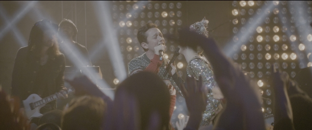 Wide shot frame from The Night Before — standing, person, human face