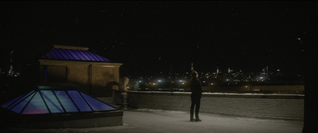 Wide shot frame from The Night Before — standing, night, person