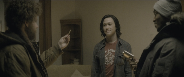 Wide shot frame from The Night Before — standing, room, hand