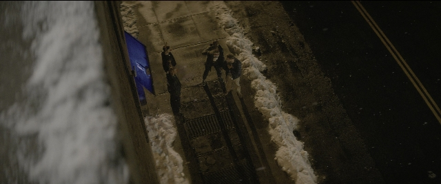 Wide shot frame from The Night Before — standing, street, night