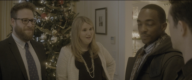 Medium shot frame from The Night Before — standing, room, dialogue
