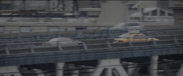 Wide shot frame from The Night Before — car, truck, taxi