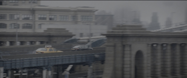 Wide shot frame from The Night Before — car, taxi, building