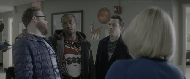 Wide shot frame from The Night Before — standing, room, dialogue