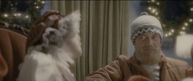 Wide shot frame from The Night Before — standing, hat, shirt
