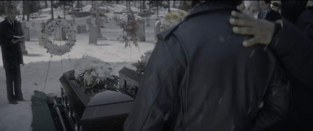 Wide shot frame from The Night Before — book, standing, suit