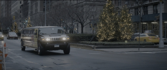 Wide shot frame from The Night Before — street, car, night