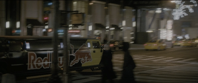 Wide shot frame from The Night Before — street, night, taxi