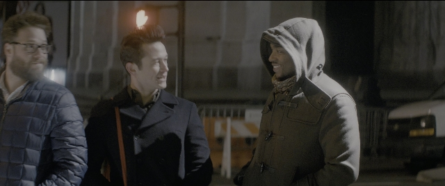 Wide shot frame from The Night Before — standing, street, coat