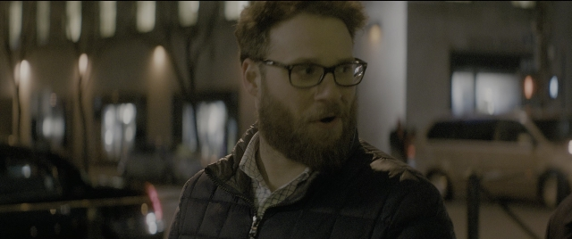Medium shot frame from The Night Before — standing, dialogue, street