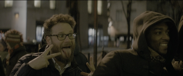Medium shot frame from The Night Before — standing, room, beard