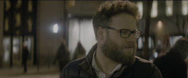 Wide shot frame from The Night Before — standing, walking, room