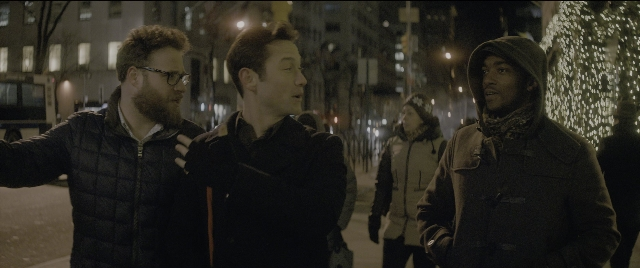 Wide shot frame from The Night Before — people, standing, group
