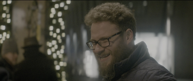 Medium shot frame from The Night Before — standing, night, beard