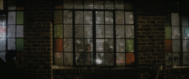 Wide shot frame from The Night Before — glass, bird, window
