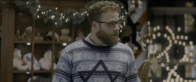 Medium shot frame from The Night Before — standing, beard, face