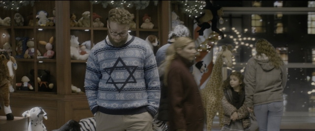 Wide shot frame from The Night Before — walking, beard, person