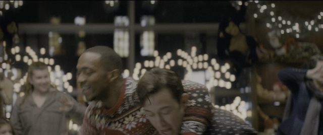 Wide shot frame from The Night Before — room, shirt, face