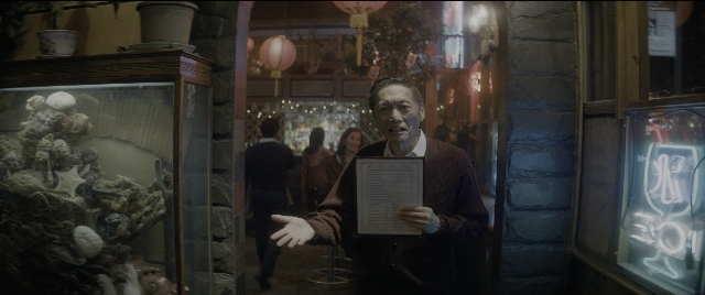 Wide shot frame from The Night Before — standing, walking, room