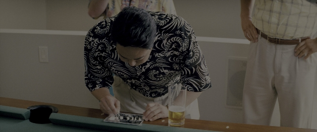 Wide shot frame from The Wolf of Wall Street — people, action, show