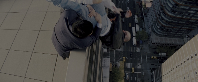 Wide shot frame from The Wolf of Wall Street — standing, street, suit