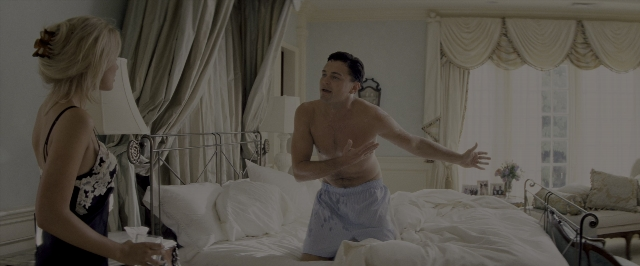Wide shot frame from The Wolf of Wall Street — sitting, standing, room