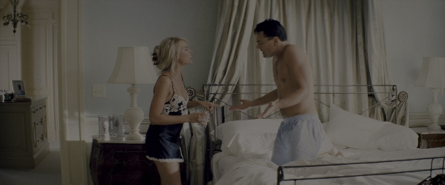 Wide shot frame from The Wolf of Wall Street — standing, room, dialogue