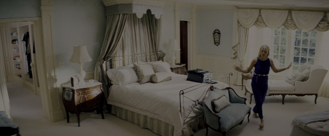 Wide shot frame from The Wolf of Wall Street — standing, room, bed