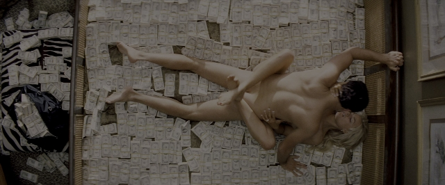 Wide shot frame from The Wolf of Wall Street — bed, face, hair