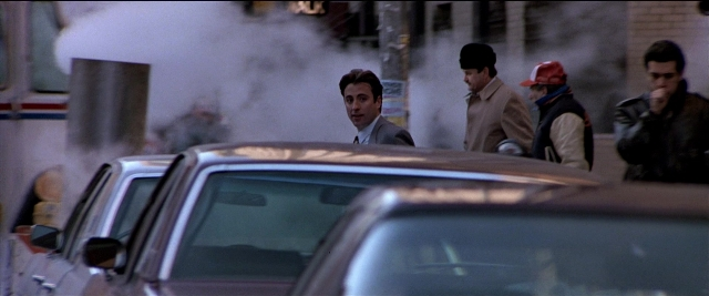 Wide shot frame from Black Rain — standing, street, car