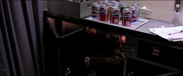 Wide shot frame from Black Rain — sitting, drink, person