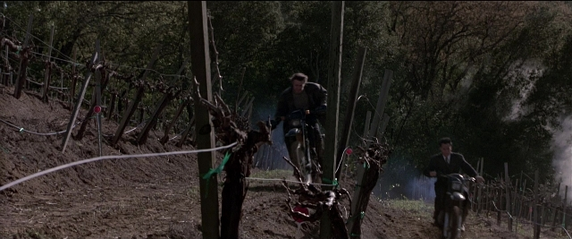 Wide shot frame from Black Rain — street, bicycle, person