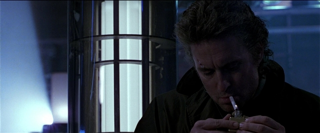 Frame from Black Rain — sitting, face, hair