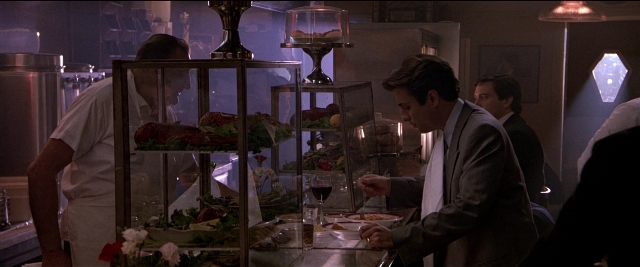 Frame from Black Rain — standing, table, kitchen