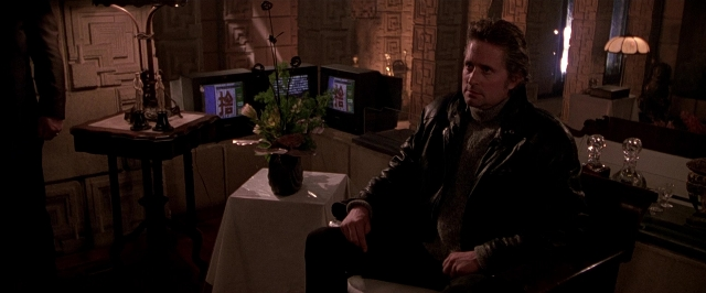 Wide shot frame from Black Rain — sitting, room, table
