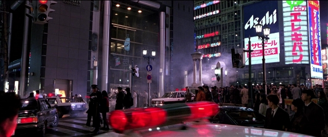 Wide shot frame from Black Rain — street, car, night