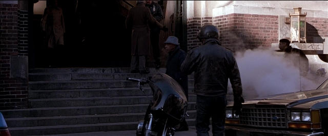 Wide shot frame from Black Rain — standing, street, car