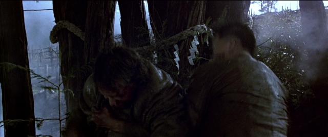 Wide shot frame from Black Rain — standing, hat, smoke